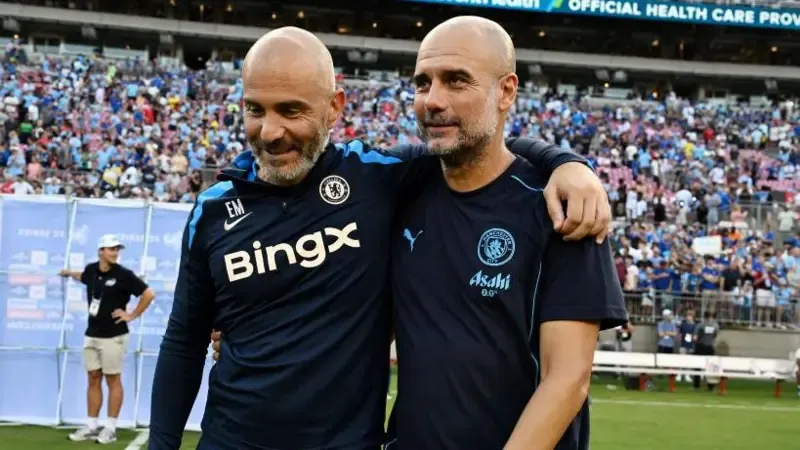 Enzo Maresca and Pep Guardiola embrace while managing opposing teams in pre-season for Chelsea and Man City