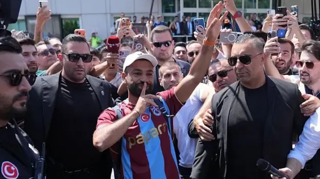 Mohamed Salah with his finger to his lips as he engages with the Trabzonspor fans